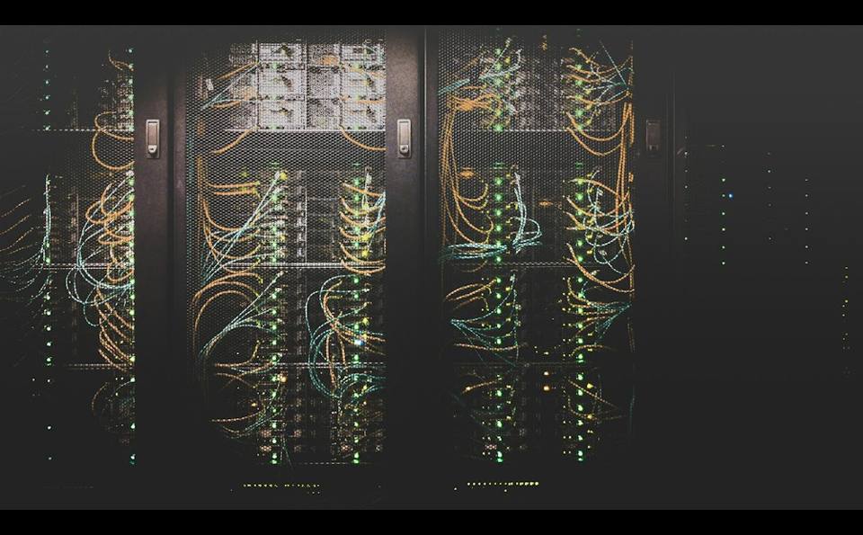 Server racks with network cabling in a data room